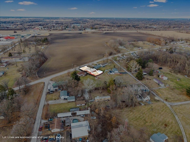 birds eye view of property with a rural view