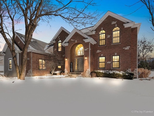 traditional home featuring brick siding