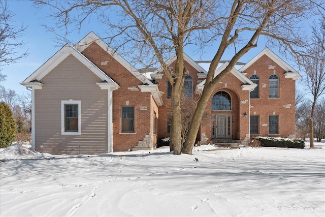 traditional-style house featuring brick siding