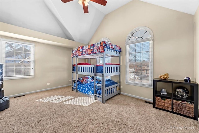 bedroom featuring lofted ceiling, a ceiling fan, visible vents, baseboards, and carpet