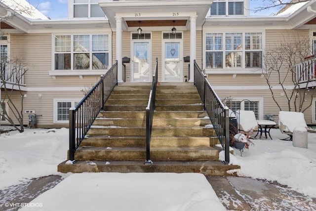 view of snow covered property entrance