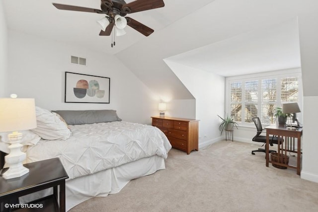 bedroom featuring light carpet, lofted ceiling, and ceiling fan