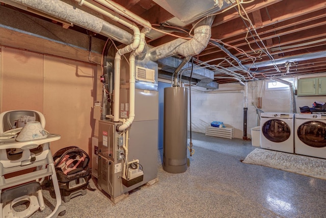 basement featuring heating unit, gas water heater, and washing machine and clothes dryer