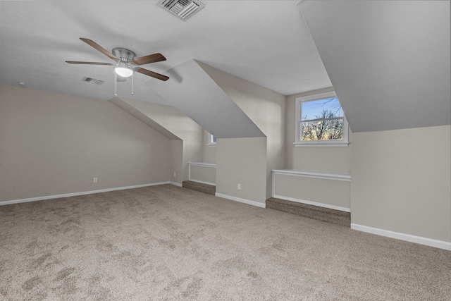 additional living space featuring ceiling fan, vaulted ceiling, and carpet