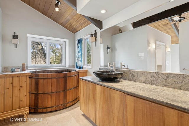 interior space with tile patterned floors, vaulted ceiling with beams, recessed lighting, wood ceiling, and vanity