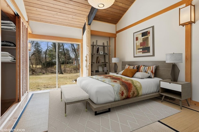 bedroom with access to outside, wood ceiling, and vaulted ceiling