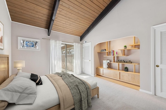 bedroom with access to outside, beamed ceiling, carpet flooring, and wooden ceiling