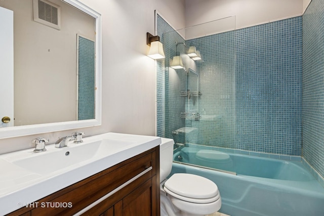 full bathroom with visible vents, toilet, vanity, and  shower combination