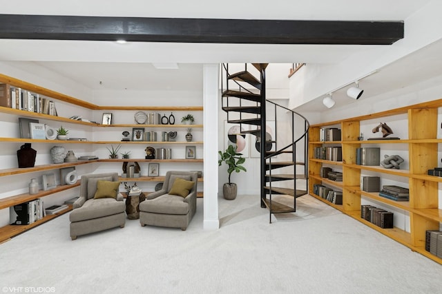 living area with rail lighting, beamed ceiling, carpet floors, and stairs