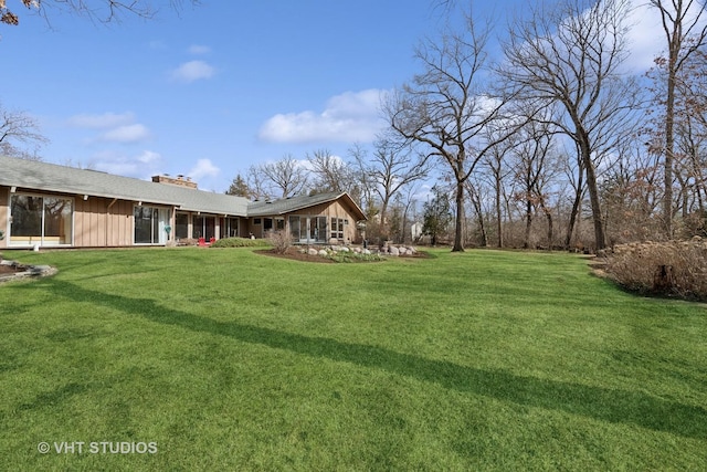 view of yard featuring a sunroom