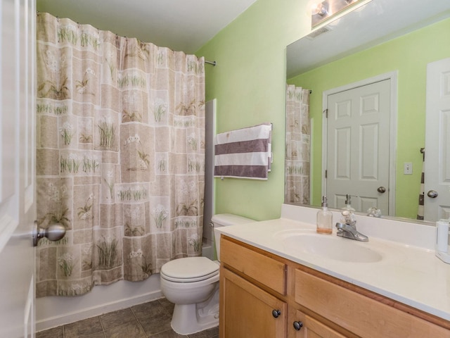 bathroom featuring vanity, visible vents, tile patterned flooring, toilet, and shower / tub combo with curtain