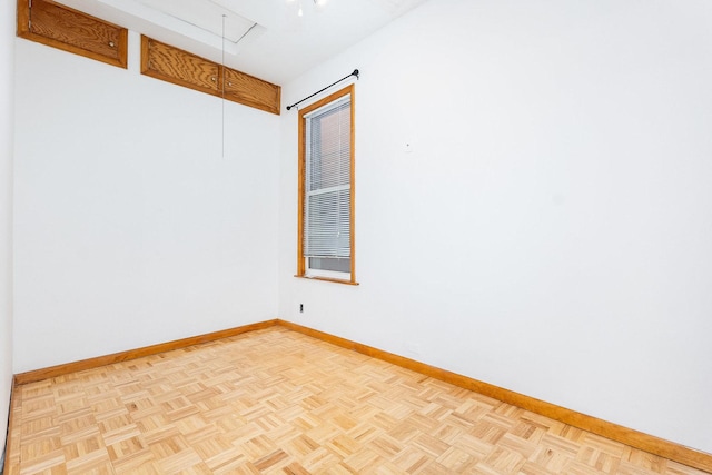 empty room with light parquet flooring