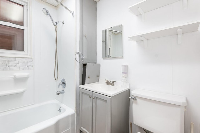 full bathroom featuring vanity, tub / shower combination, and toilet