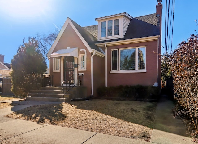 bungalow-style home featuring a chimney