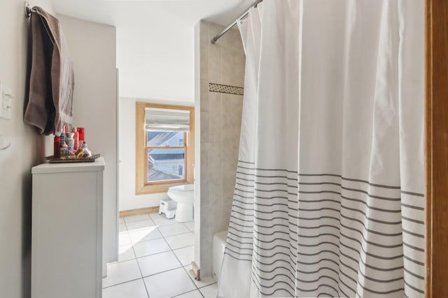 full bathroom with toilet, shower / bath combo, and tile patterned floors