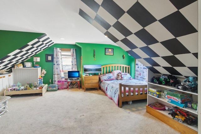 carpeted bedroom with lofted ceiling