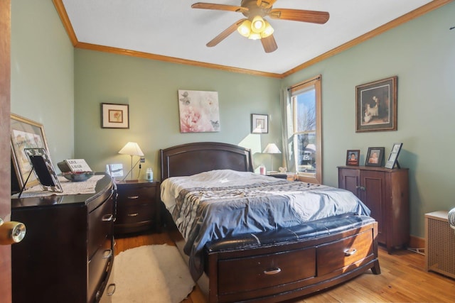 bedroom with ornamental molding, ceiling fan, baseboards, and wood finished floors