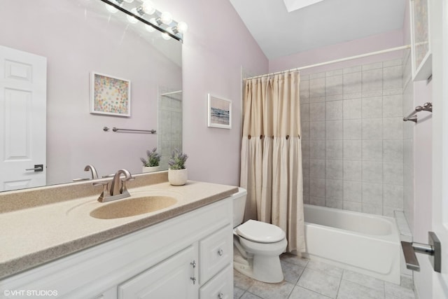 full bathroom featuring a skylight, toilet, tile patterned floors, shower / bath combination with curtain, and vanity