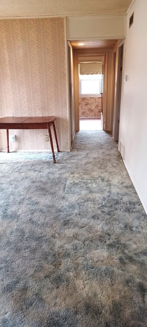 corridor featuring carpet