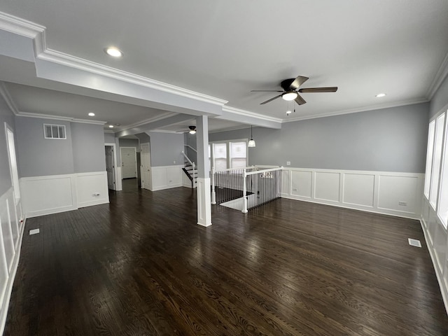 interior space featuring dark hardwood / wood-style flooring, crown molding, and ceiling fan