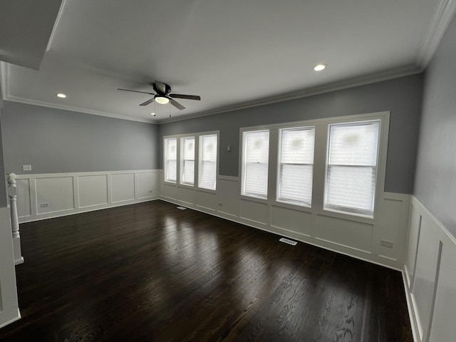 unfurnished room featuring dark hardwood / wood-style flooring, crown molding, and ceiling fan