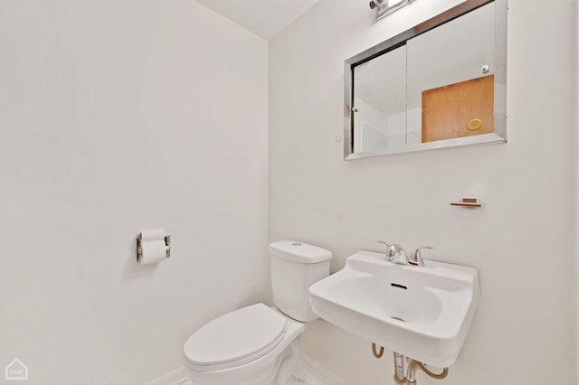 bathroom featuring sink and toilet