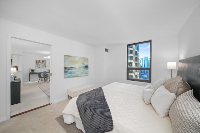 bedroom with light colored carpet