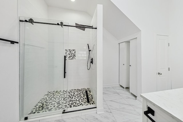 full bathroom featuring marble finish floor and a shower stall