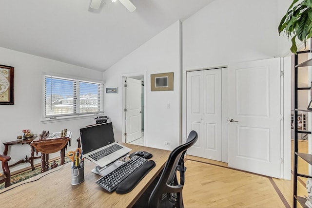 office featuring high vaulted ceiling, light wood finished floors, and a ceiling fan