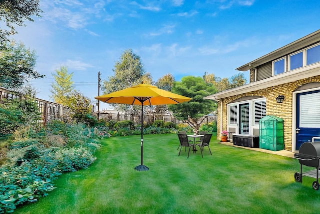 view of yard with a fenced backyard