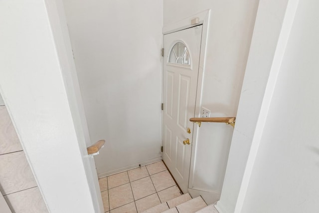 interior space with tile patterned flooring and baseboards