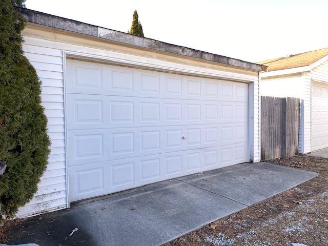 garage featuring fence