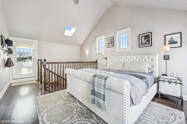 bedroom featuring dark wood-style floors, lofted ceiling with skylight, and baseboards