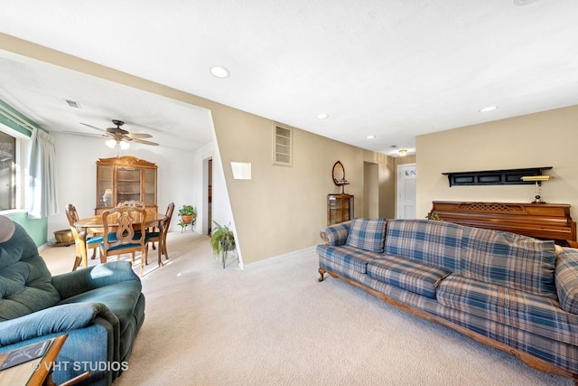 carpeted living area featuring visible vents, recessed lighting, baseboards, and ceiling fan