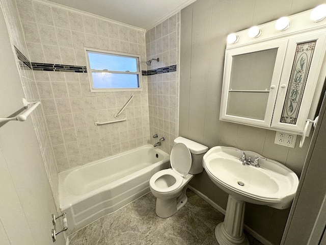 full bathroom with crown molding, tiled shower / bath, toilet, and sink