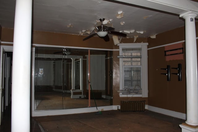 view of patio with radiator and ceiling fan