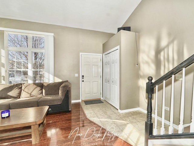 living room with lofted ceiling and hardwood / wood-style floors