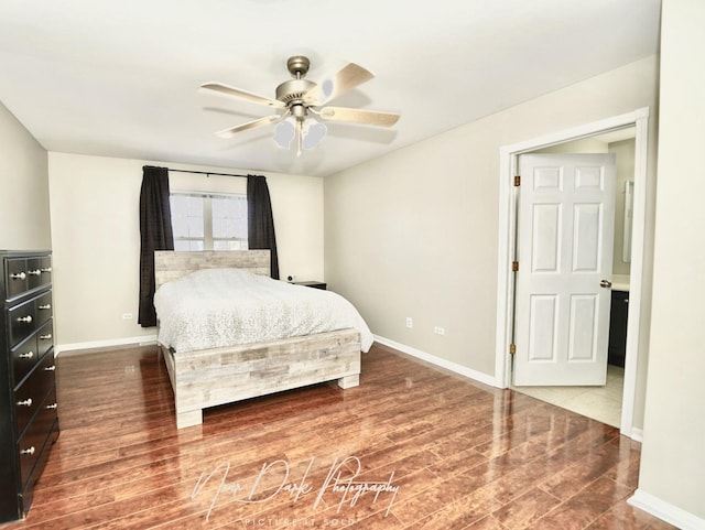 bedroom with ceiling fan and hardwood / wood-style floors