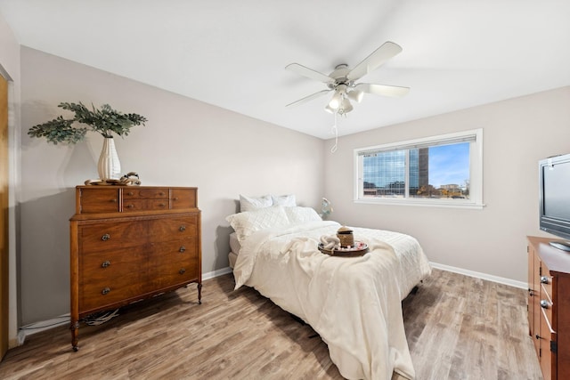 bedroom featuring light hardwood / wood-style floors and ceiling fan