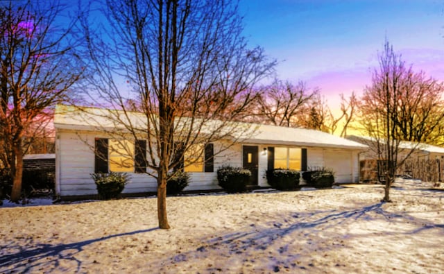 ranch-style home featuring a garage