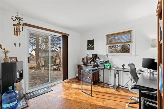 office space with visible vents and baseboards