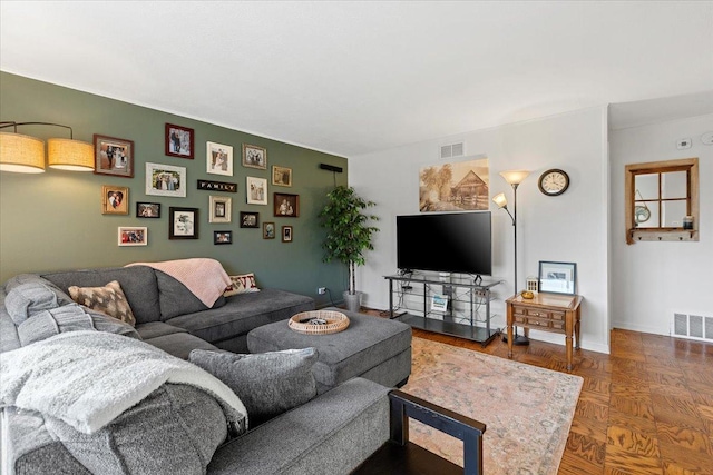 living area featuring visible vents and baseboards