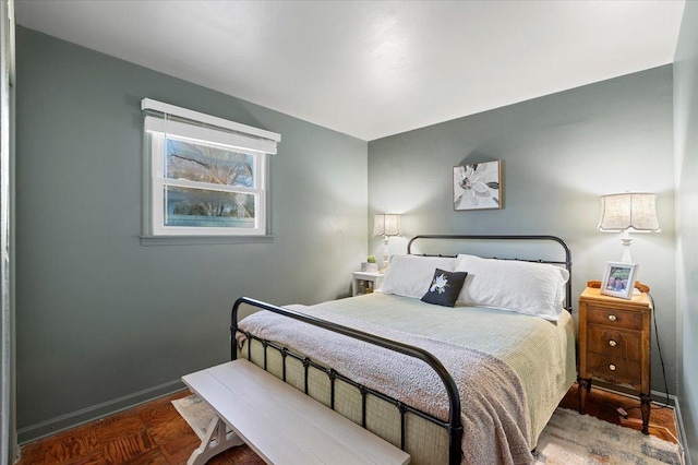 bedroom featuring baseboards