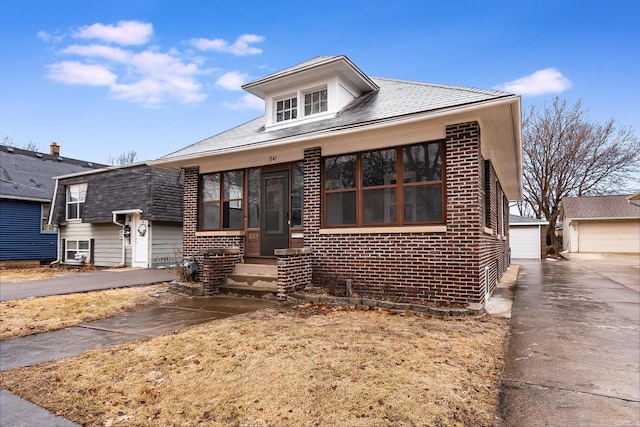 view of front of home featuring an outdoor structure and a garage