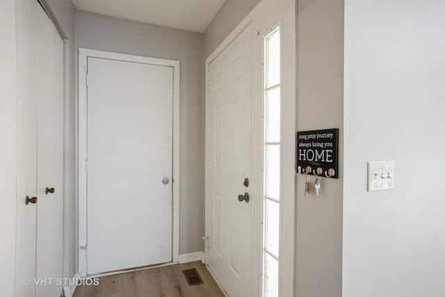 doorway to outside featuring visible vents and light wood finished floors