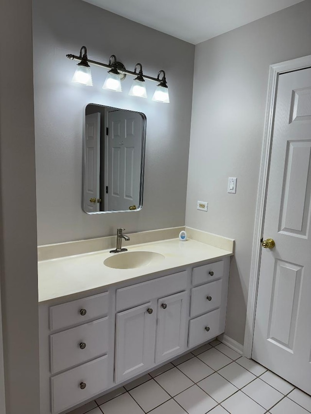 bathroom with tile patterned floors and vanity