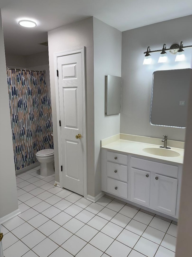 bathroom featuring vanity, curtained shower, tile patterned floors, and toilet