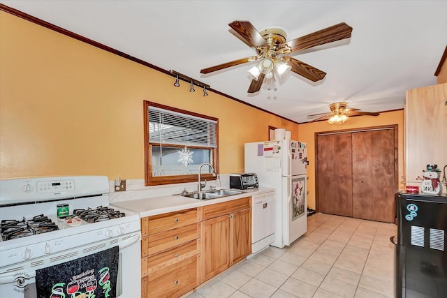 kitchen with white appliances, light countertops, crown molding, a sink, and light tile patterned flooring