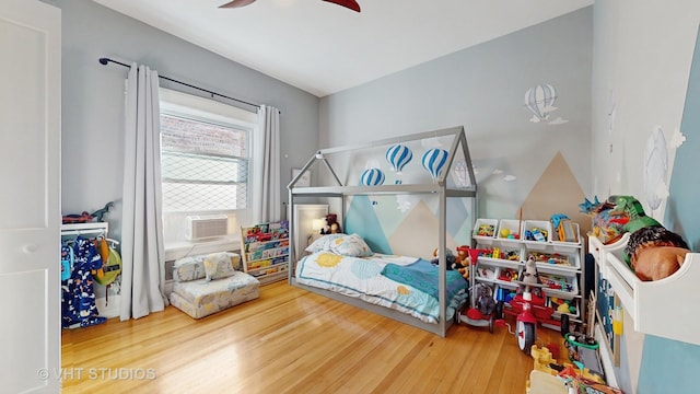 bedroom featuring ceiling fan and wood finished floors