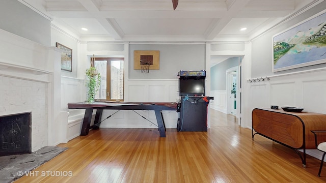 interior space featuring light wood-type flooring, beam ceiling, and coffered ceiling